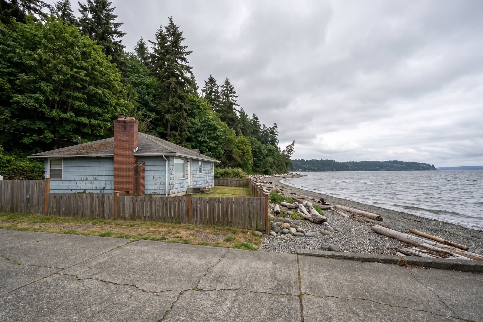 A West Seattle home near Puget Sound, its brick chimney above the roofline